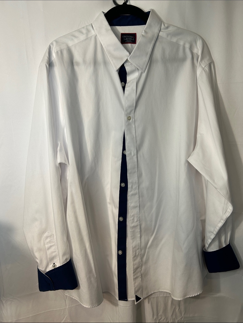 UNTUCKit White Dress Shirt with Navy Button Placket and Cuff Trim
